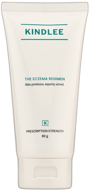 El tubo de la Crema Calmante de KindleeRx, The Eczema Regimen, el producto real sobre un fondo teal suave